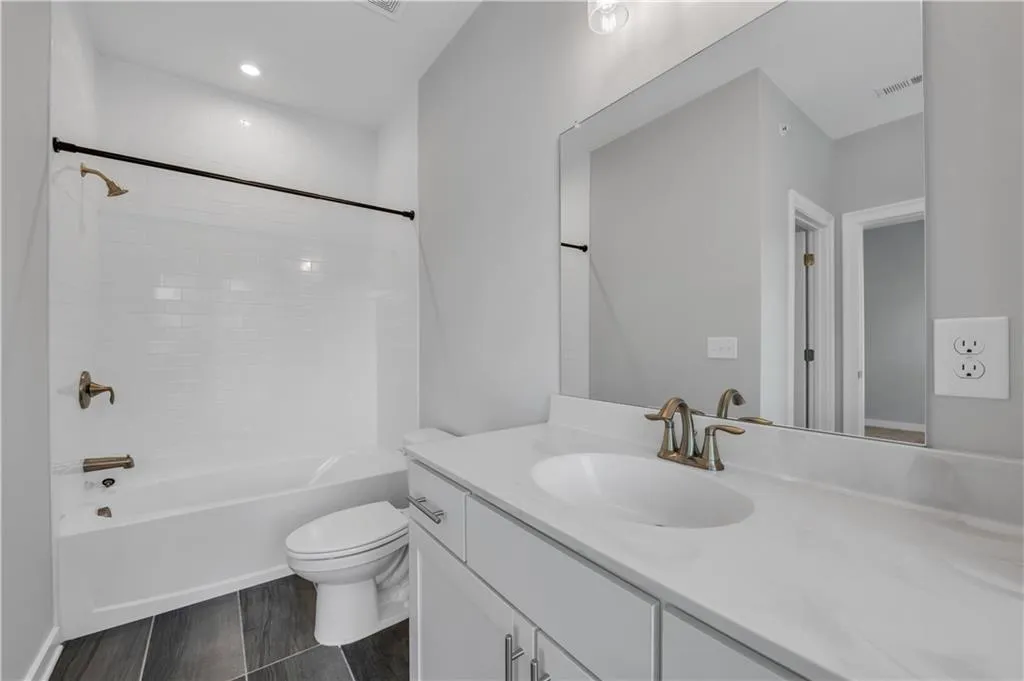 Bathroom featuring vanity and tub / shower combination