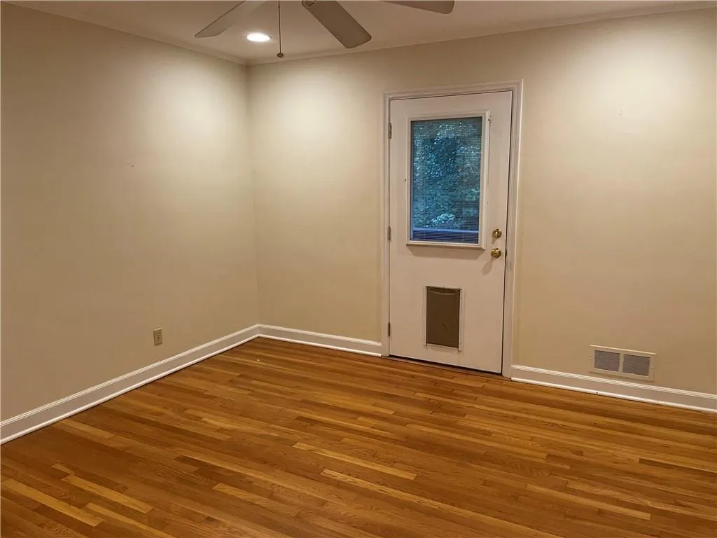 Bedroom 1 - with exterior door and mirrored closet