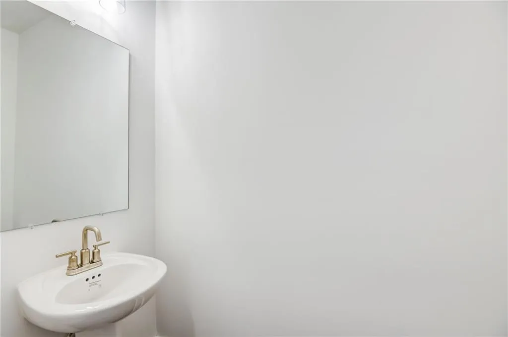 Powder room on the main floor. Photo example only not actual home.