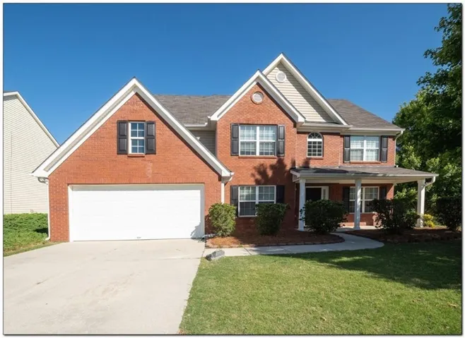 Brick exterior with gabled roof lines and a covered front porch