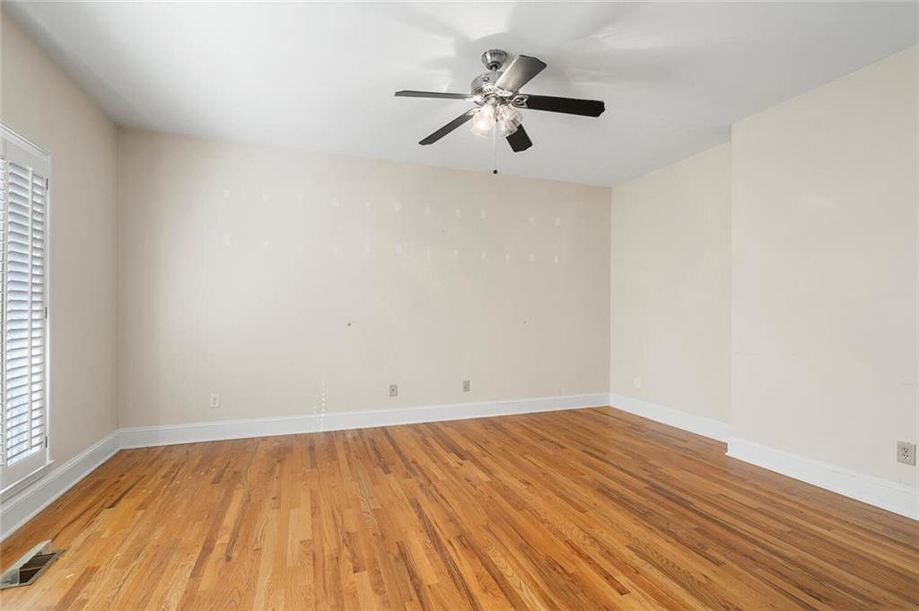 Unfurnished room featuring ceiling fan and light hardwood / wood-style floors