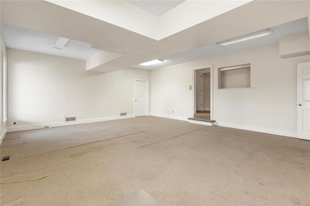 Empty room featuring carpet floors