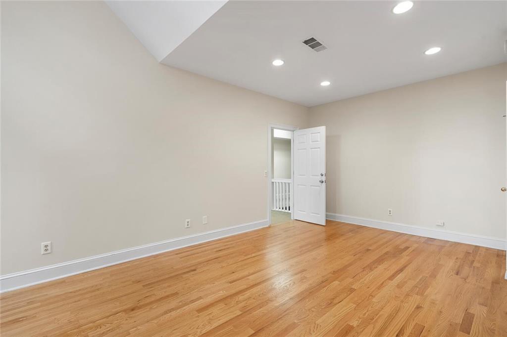 Unfurnished room with light wood-type flooring