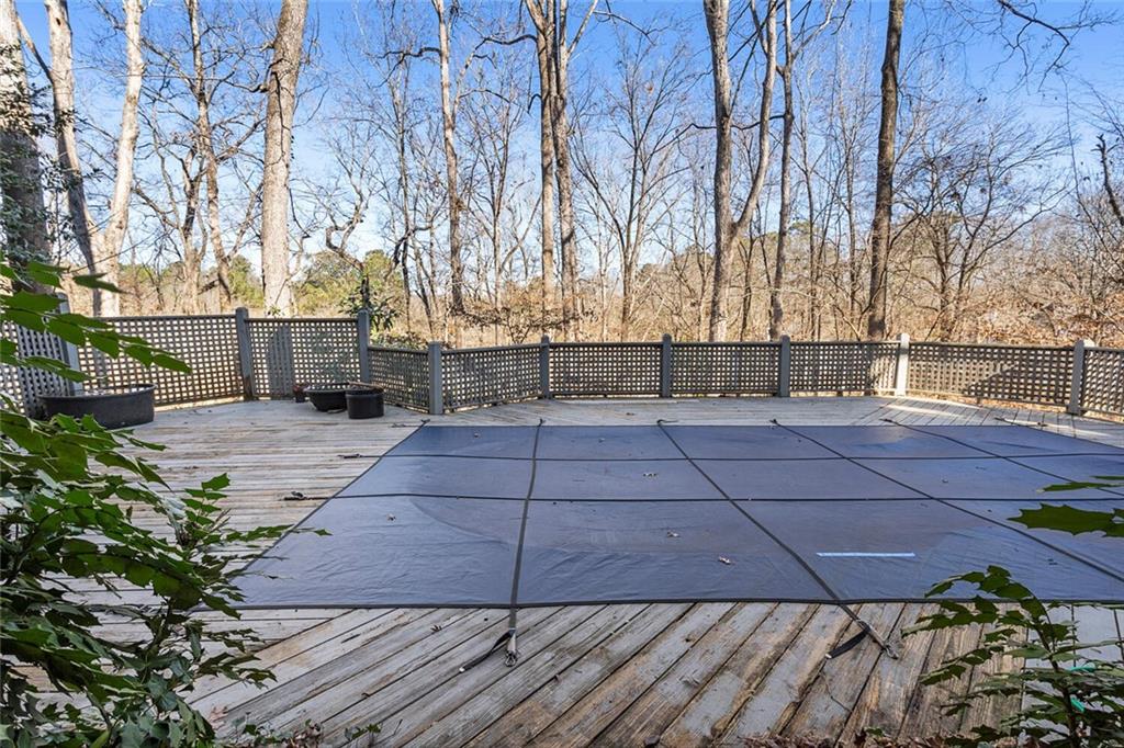 View of swimming pool featuring a deck