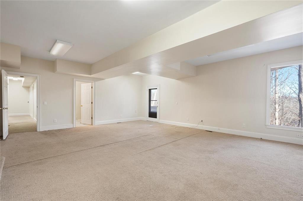 Unfurnished room with light carpet