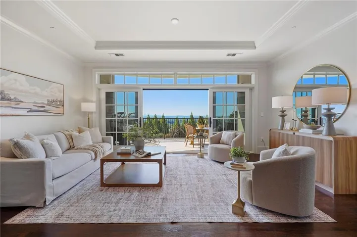 Recessed lighting and crown molding accentuate the ceiling