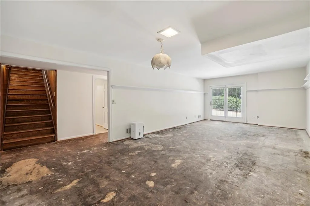 View of wide staircase from basement