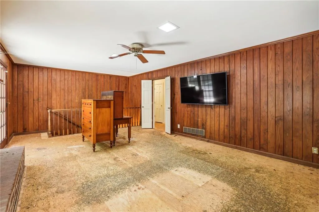 Family room with wood paneling walls
