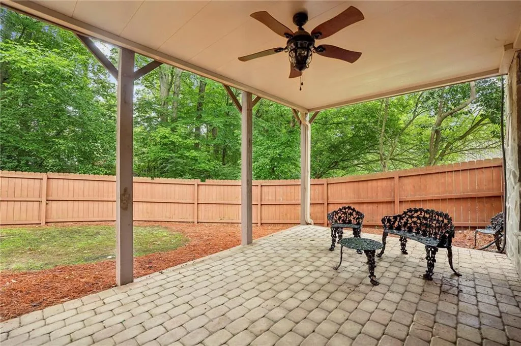 Covered patio with water catching ceiling. Fenced backyard for pets.