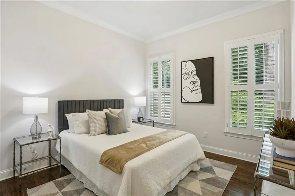 First floor Bedroom #1 with ornamental molding, walk-in closet and hardwood floors