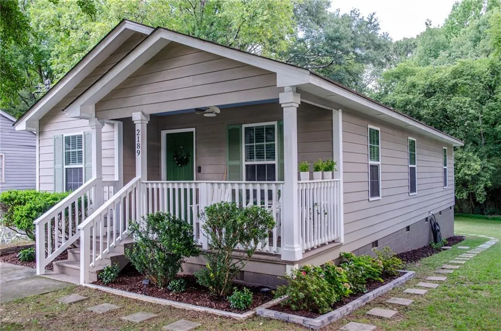 View of front facade with crawl space and a porch