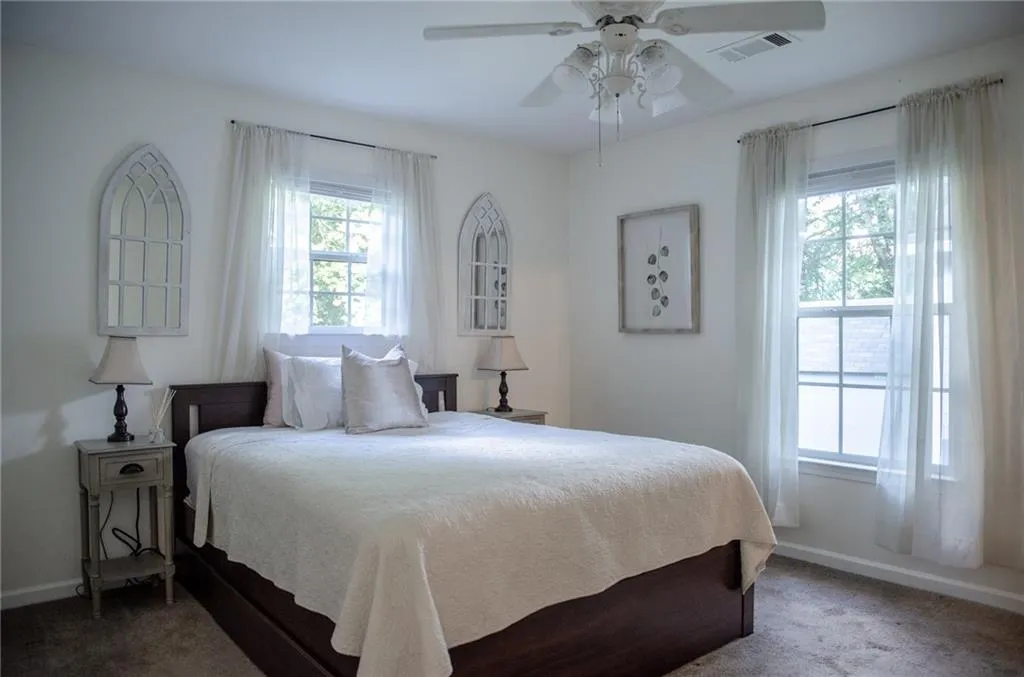 Bedroom featuring carpet and ceiling fan