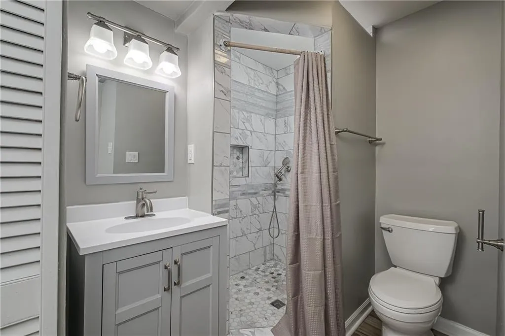 Private bath in bedroom #4 includes a beautiful tiled shower