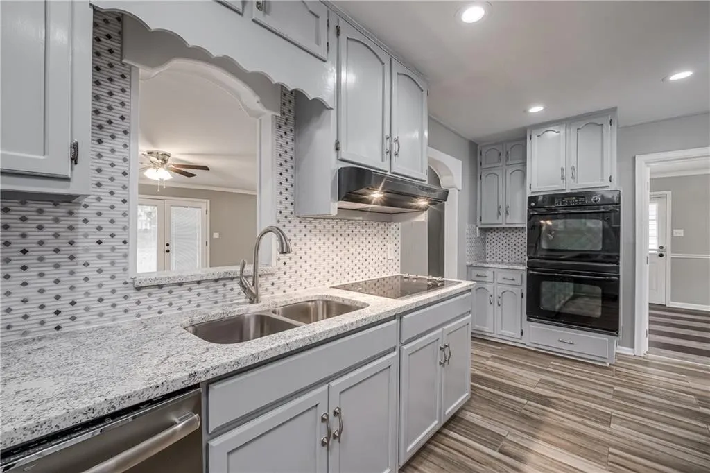 Kitchen with Double Oven looks out to Family Room