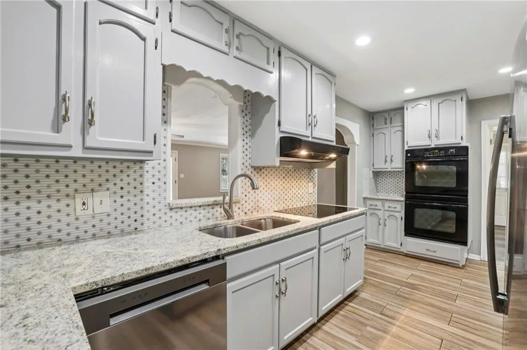 Kitchen with Double Oven looks out to Family Room