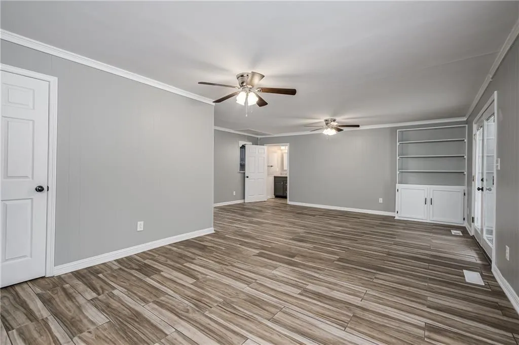 Family Room with view to Breakfast Room and Powder Room.  More built-in bookshelves as well