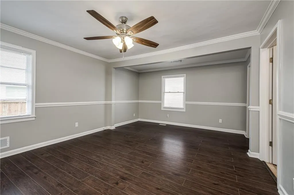 The oversized Primary Bedroom with Sitting Area and newer LVP flooring