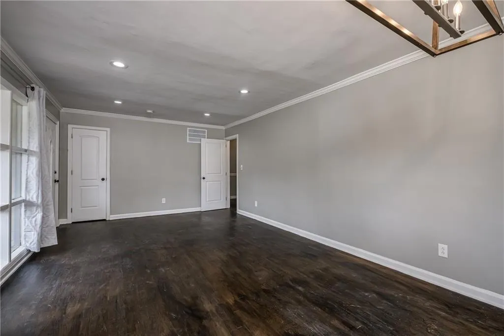 Living room with recessed lighting and hardwood flooring