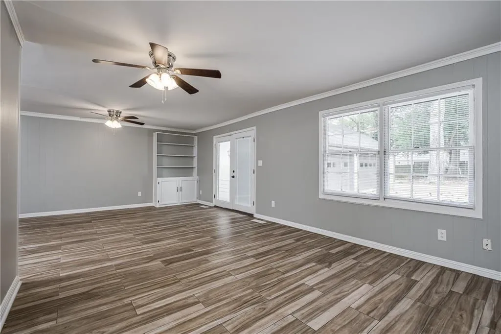 French doors in Family Room lead to the large driveway/courtyard and detached 3 car garage