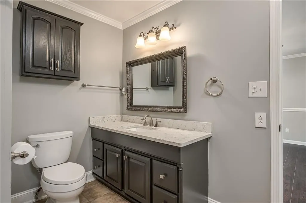 The large vanity and low-flow toilet in the Primary Bathroom