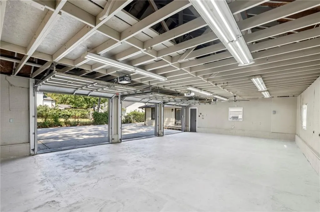 Garage featuring a garage door opener