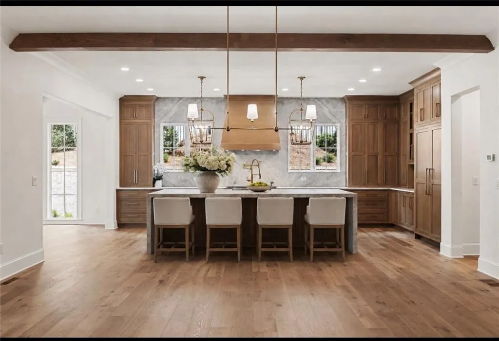 Spacious kitchen featuring Omega Cabinetry, white oakwood-finish.