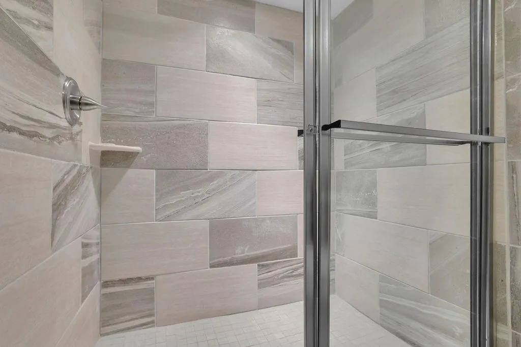 Bathroom with a shower with door