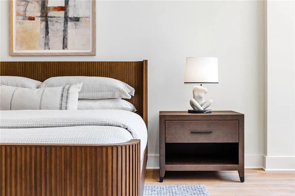 Neutral-toned interior featuring light wood-finish flooring and smooth, light-colored wall surfaces