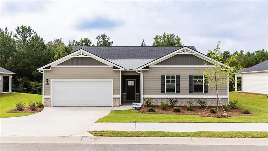 Single-story residence featuring a two-car garage, gray siding, dark shutters, and a dark shingle roof