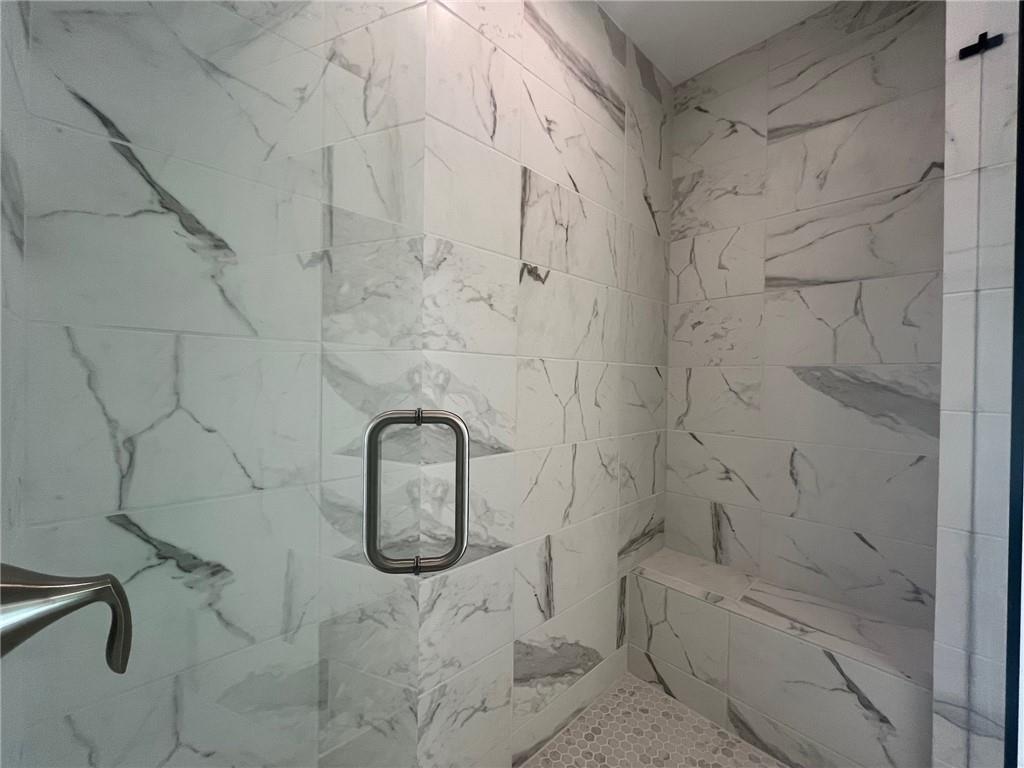 Bathroom with tiled shower