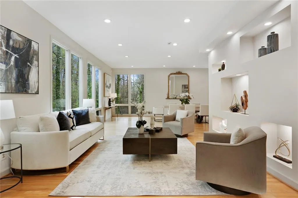 2 living areas and 12-seat dining area all open concept with amazing natural light, an entertainers dream