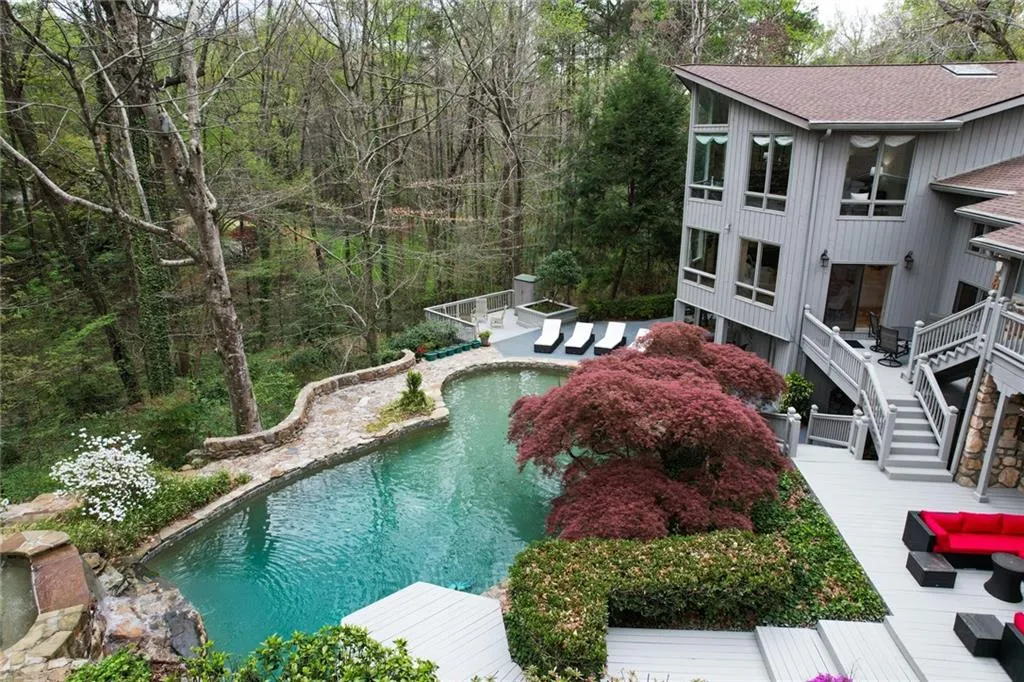View of swimming pool featuring a wooden deck