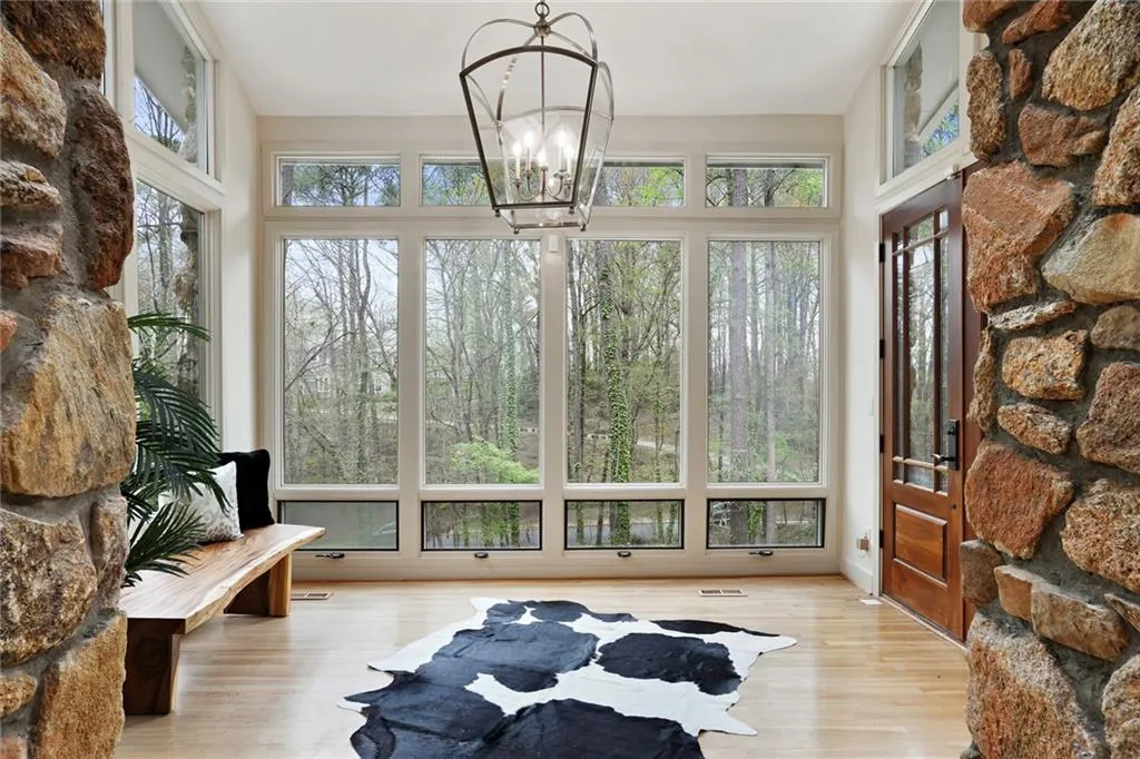 Entry foyer with high ceilings and skylights bringing in natural light