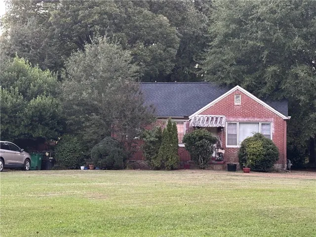 Brick exterior with an asphalt shingle roof