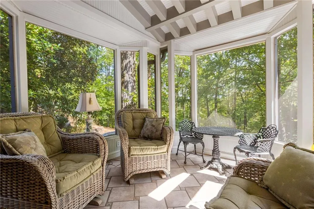 View of screened porch/sitting area overlooking backyard.