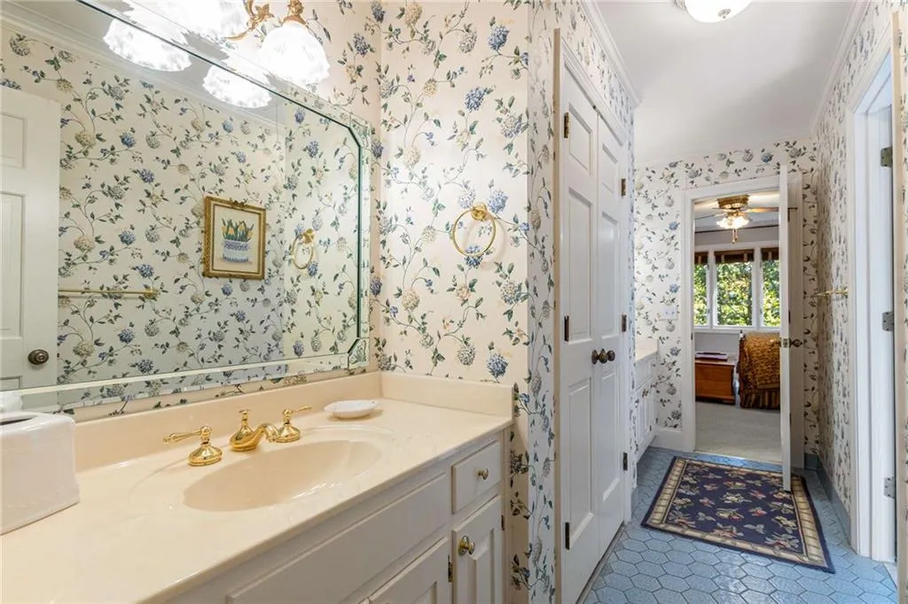 Jack and Jill vanity and spacious linen closet.