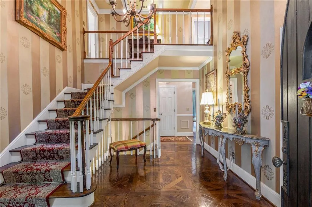 With high ceilings, ornamental molding and parquet floors this home welcomes you as you enter.
