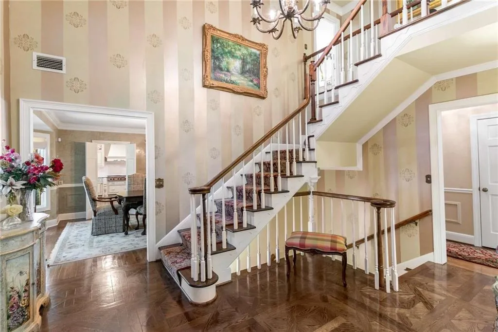 Wide foyer and spacious staircase to upper and lower levels.