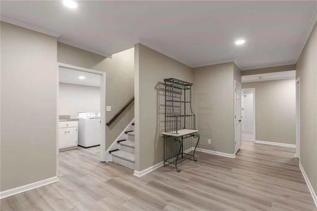 Recently renovated terrace level with light grey LVP ooring.