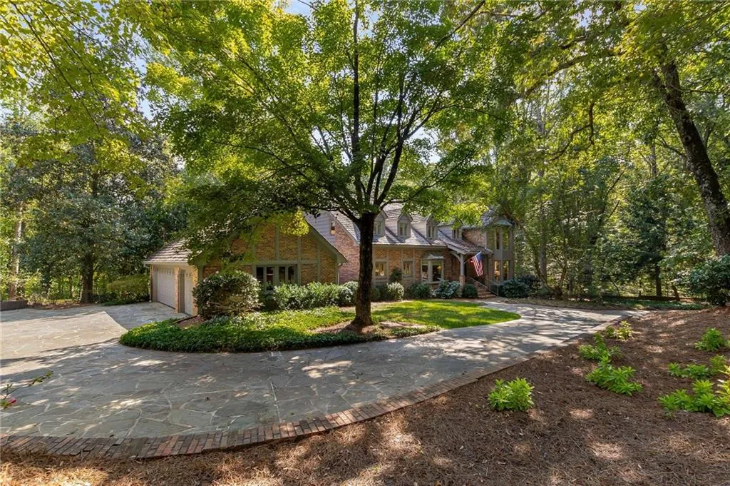 Spacious driveway with courtyard and oversized 3 car garage.