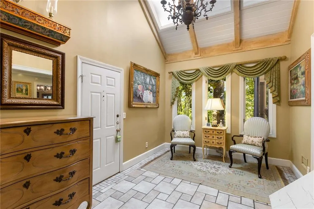 Office/den with a charming vaulted ceiling with wood beams