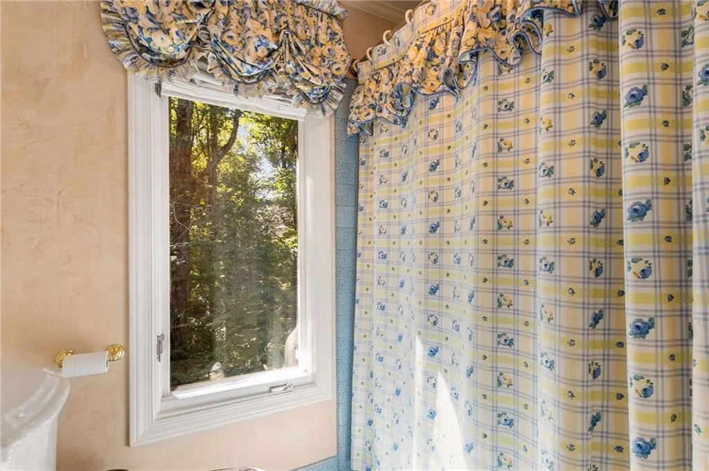 Sweet window in Jack and Jill bath overlooking the private, side yard.