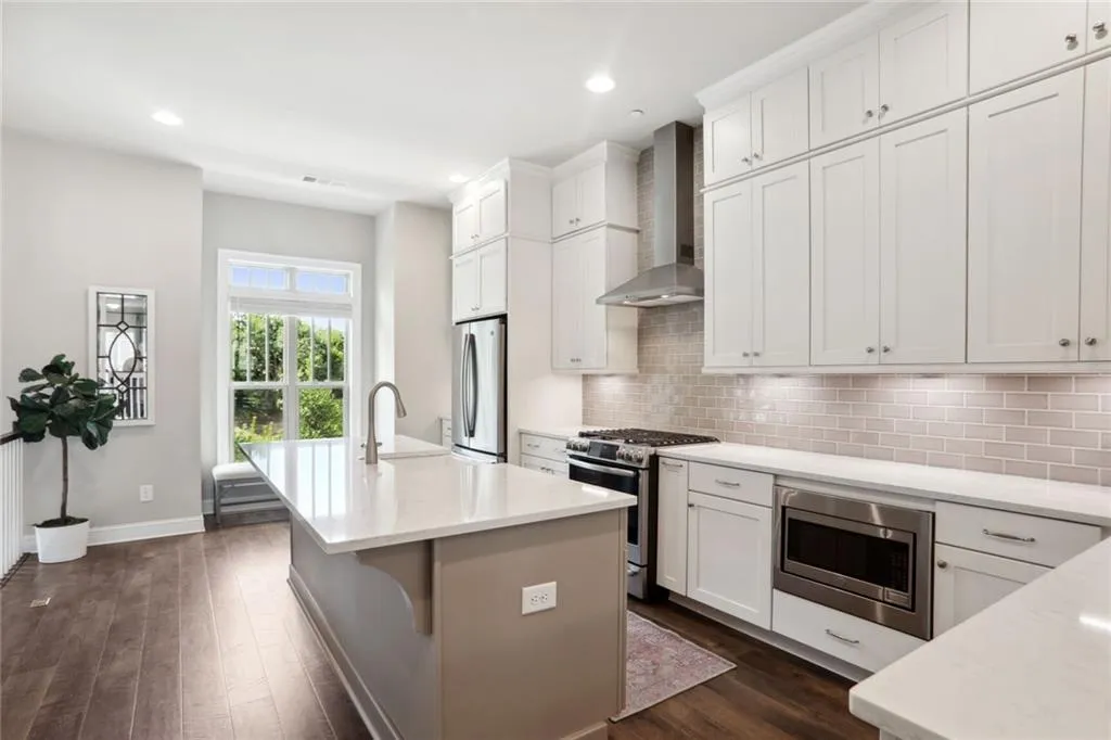 The kitchen has both views of the pond, full sun all day, island that can accommodate chairs, a breakfast bar, and space to add a table or window seat.