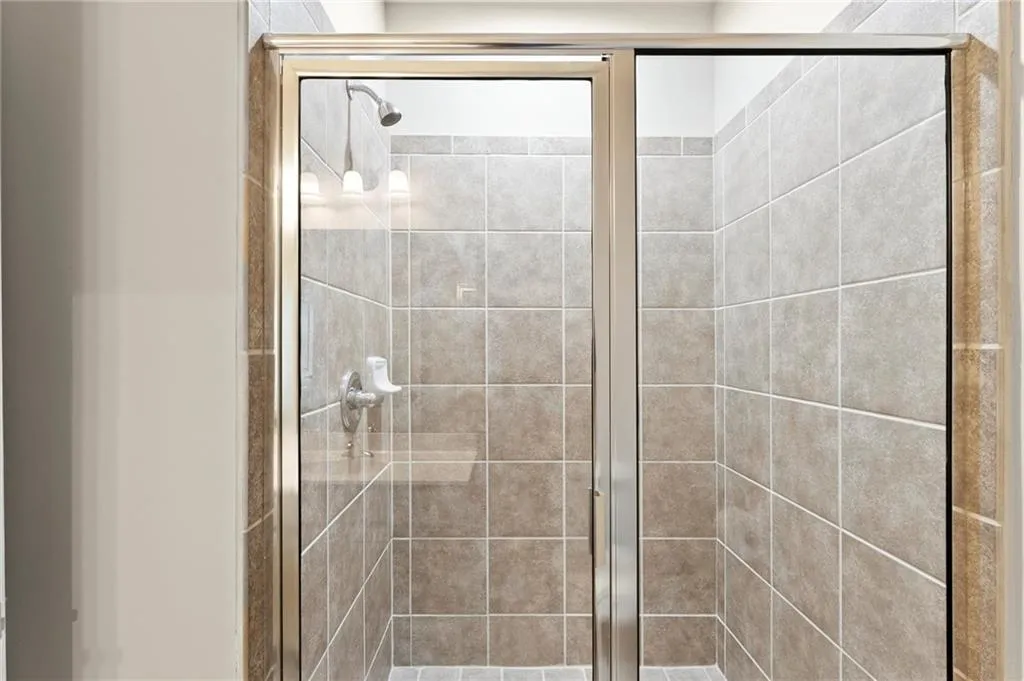 Bathroom featuring a shower stall