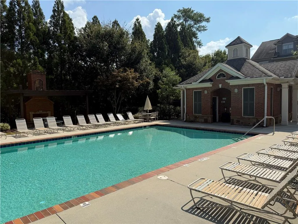 Community pool featuring a patio