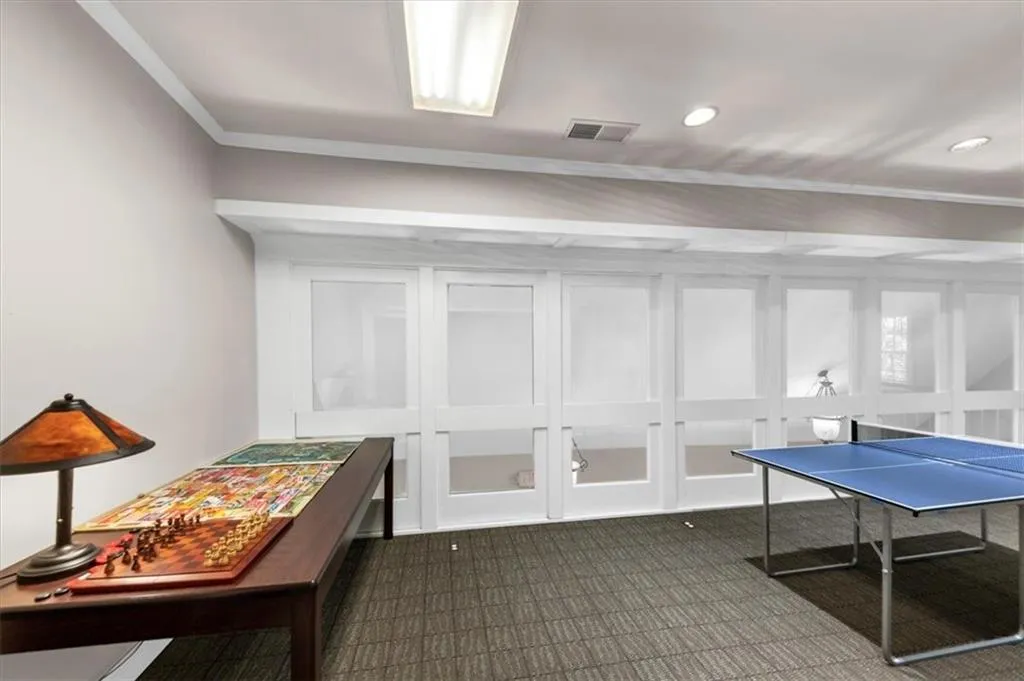 Game room featuring ornamental molding