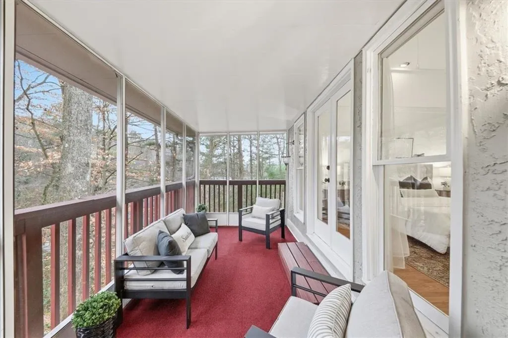 Sunroom / solarium with outdoor lounge area and french doors