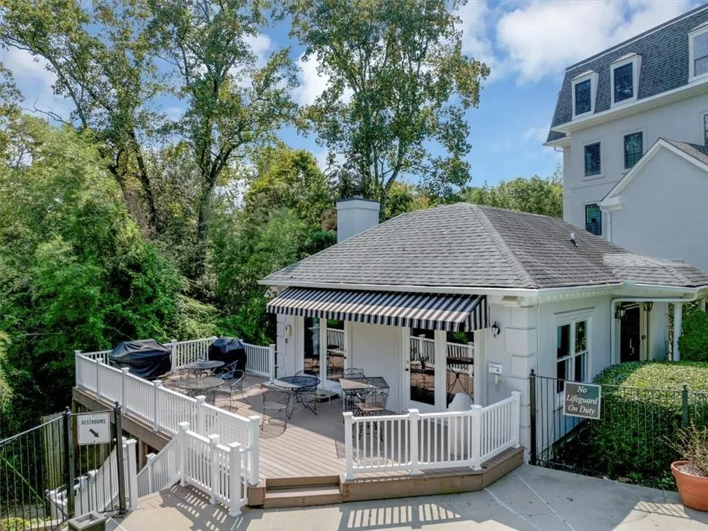 Deck with outdoor dining space and area for grilling