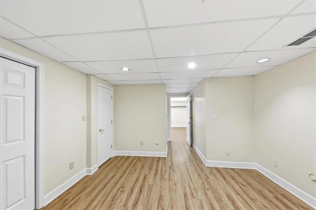 Empty room featuring recessed lighting and light wood-style floors