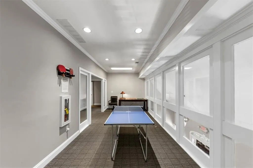 Recreation room featuring crown molding and recessed lighting